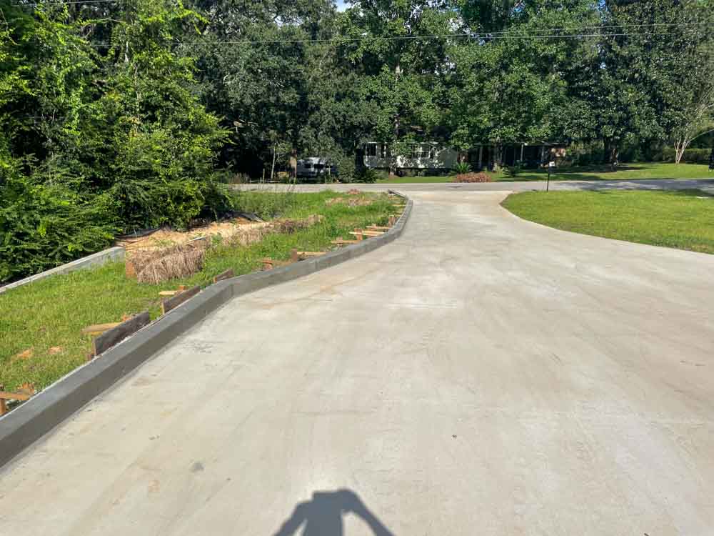 Concrete Parking Wheel Stops on a newly constructed parking space/driveway